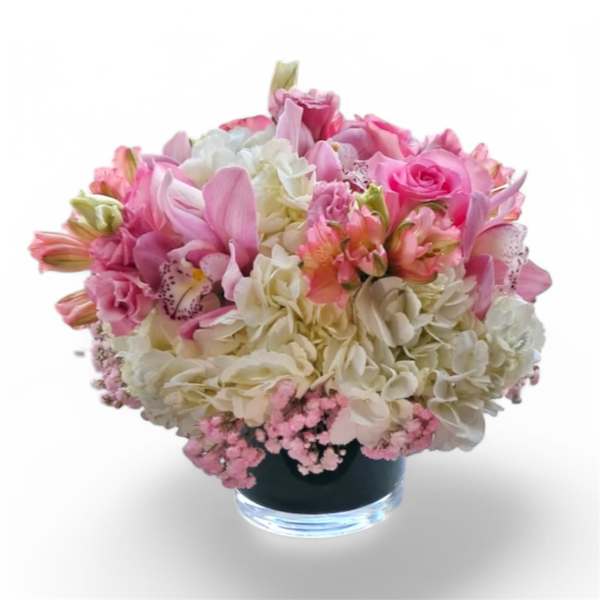 Pink and white mixed bouquet in a glass vase