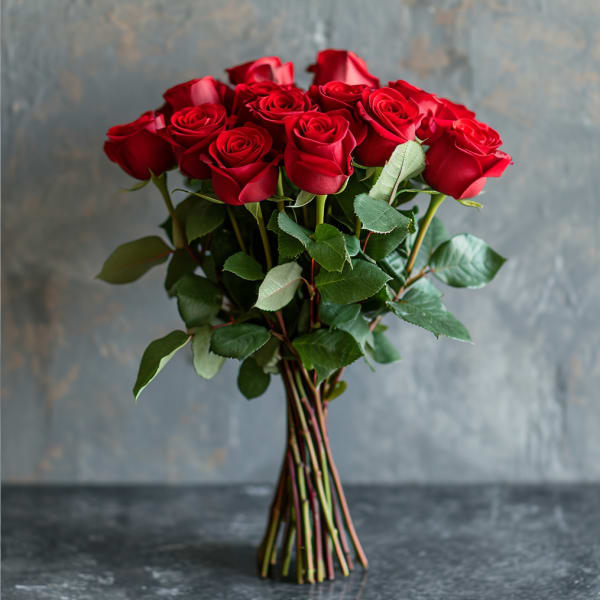 Bouquet of red roses with green leaves