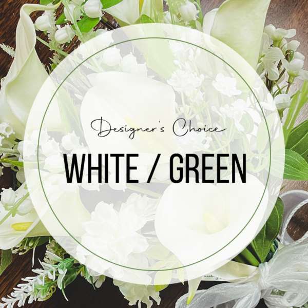 White and green floral arrangement with calla lilies and small white blooms