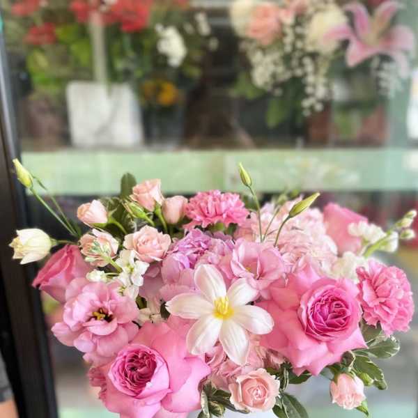 Pink and white bouquet in a white vase