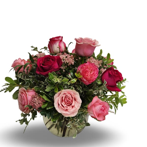 Bouquet of pink and red roses in a glass vase