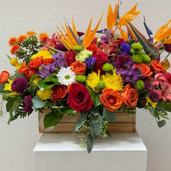 Colorful mixed flower arrangement in a wooden box