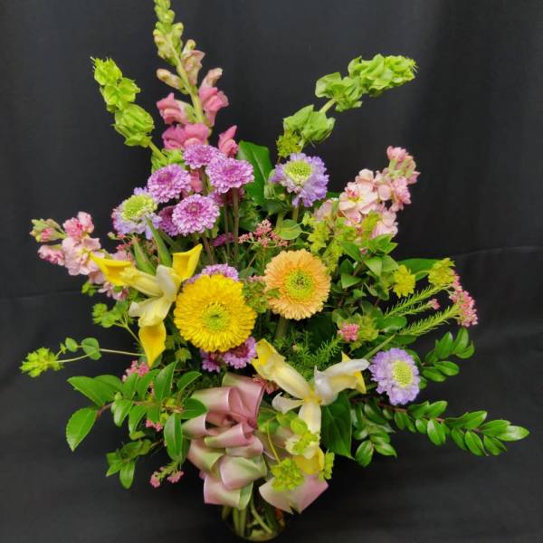 Mixed bouquet with yellow lilies, purple mums, and pink flowers
