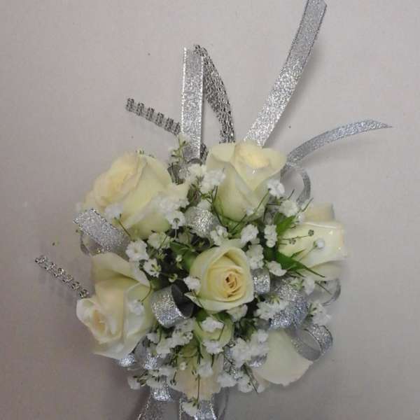 Small bouquet of cream roses with silver ribbon accents