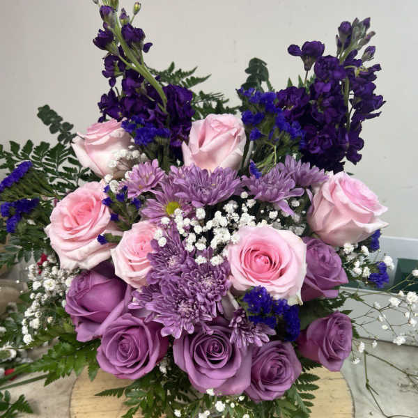 Bouquet of pink and purple roses with lavender chrysanthemums
