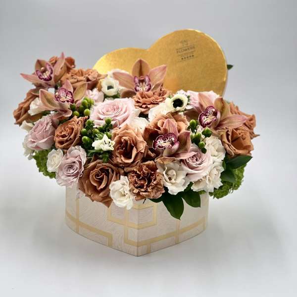 Heart-shaped flower box with roses, orchids, and carnations