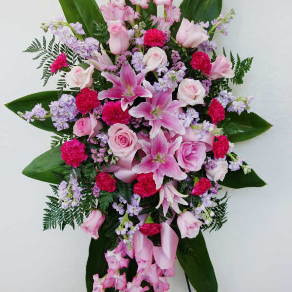 Pink and lavender floral standing spray with lilies and roses