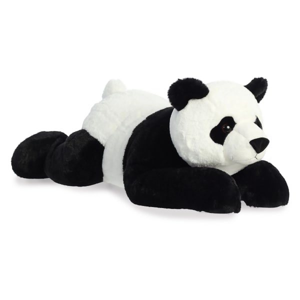 Plush panda bear lying down on a white background