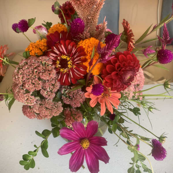 Mixed bouquet with red, pink, orange, and purple flowers