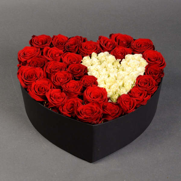Heart-shaped box of red and white roses