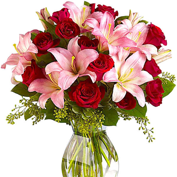 Pink lilies and red roses in a clear glass vase