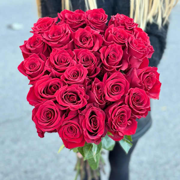 Bouquet of red roses held upright