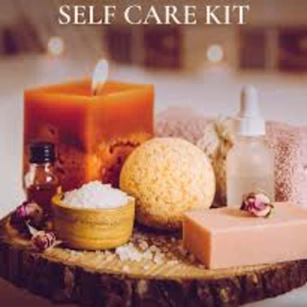 Self-care gift kit with a candle, lotion, and bath items