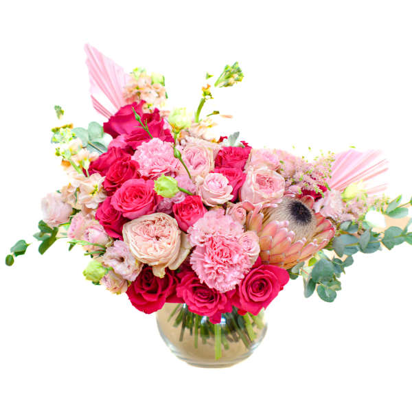 Pink and red rose bouquet in a glass vase