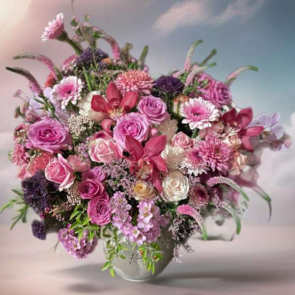 Pink and white mixed bouquet in a round vase