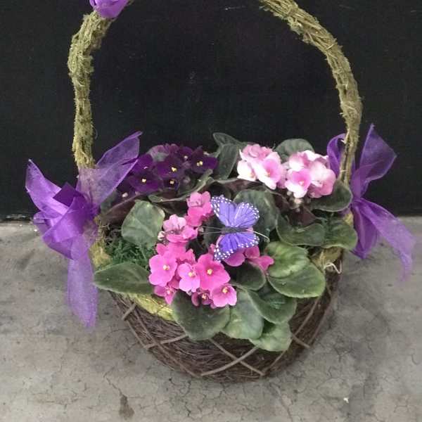 Basket planter with pink and purple flowers and ribbon bows