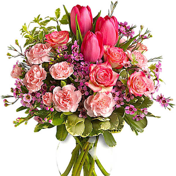 Pink tulips and roses arranged in a clear glass vase