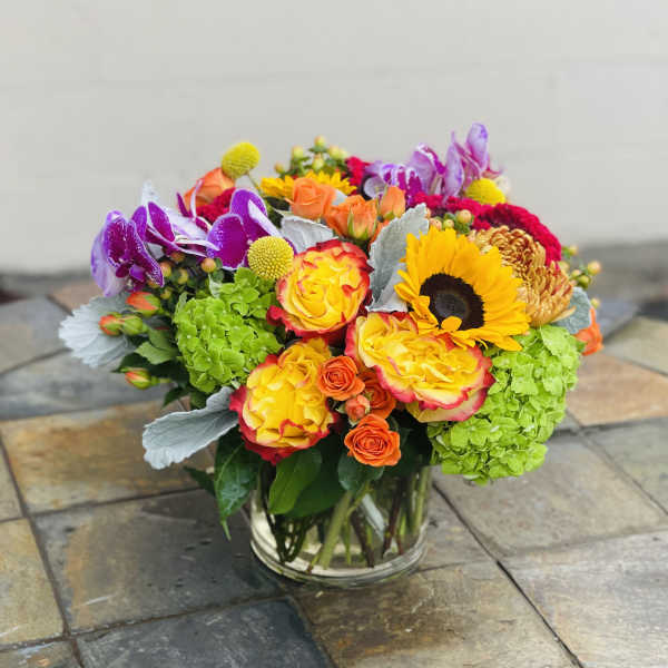 Colorful mixed bouquet in a clear glass vase