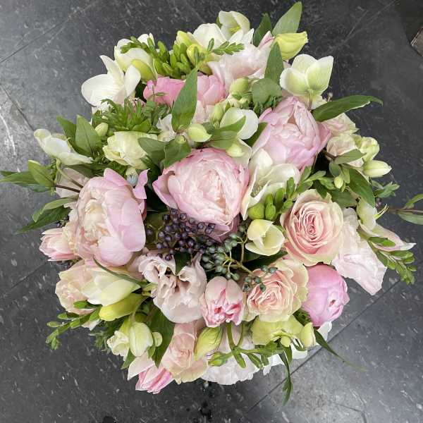 Bouquet of pink and white flowers with green foliage