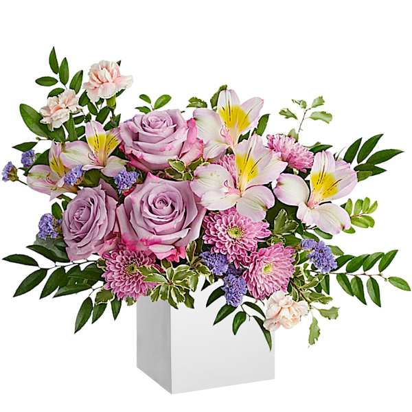 Lavender roses and pink lilies in a white box with greenery