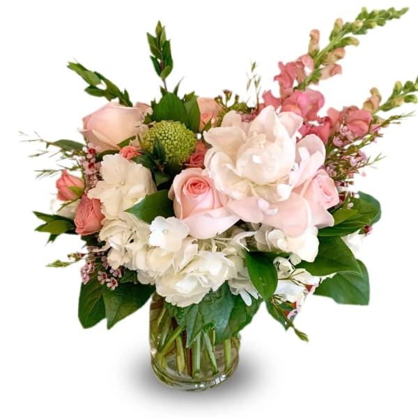 Pink and white bouquet in a clear glass vase
