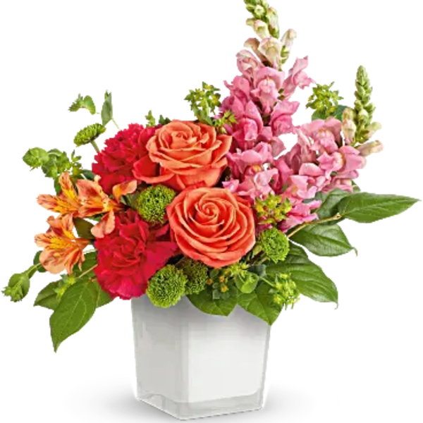 Colorful bouquet of roses and snapdragons in a white vase
