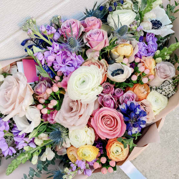 Mixed bouquet of pink, white, purple, and orange flowers