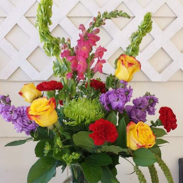 Colorful mixed bouquet in a clear glass vase