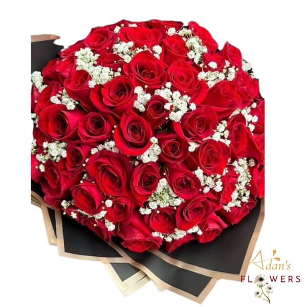 Bouquet of red roses with white baby's breath in black wrap