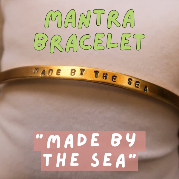 Gold bracelet engraved with the words "Made by the Sea"