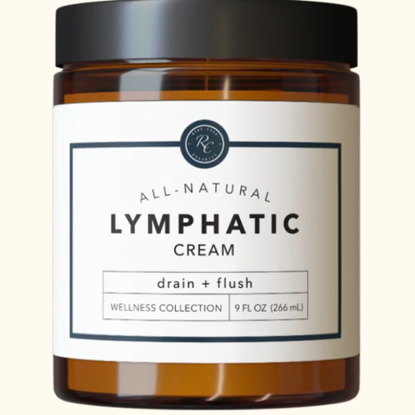 Amber jar of lymphatic cream with a black lid and white label