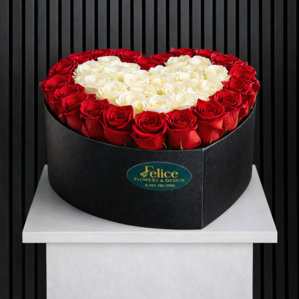Heart-shaped box of red and white roses