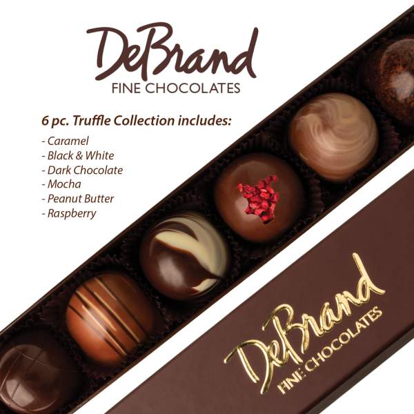 Box of six assorted round chocolate truffles in a slim brown gift box.