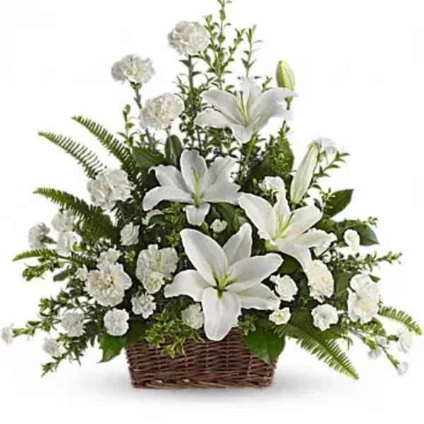 White lilies and carnations in a wicker basket