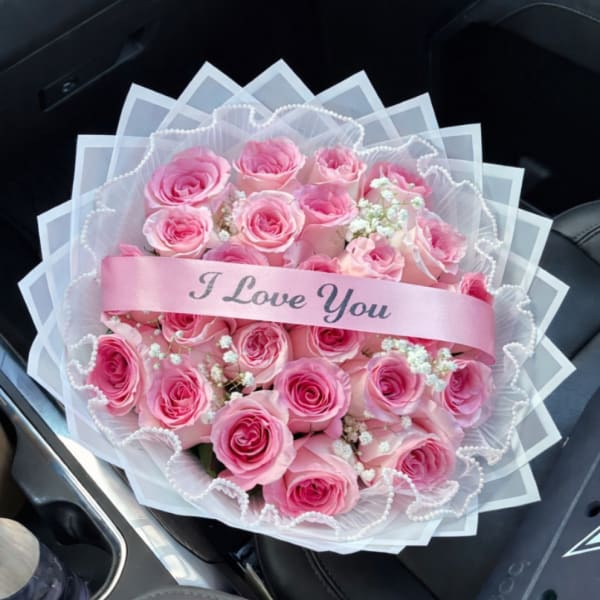 Pink rose bouquet with a pink "I Love You" ribbon