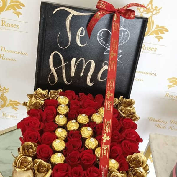 Box of red and gold roses with Ferrero Rocher chocolates and a ribbon