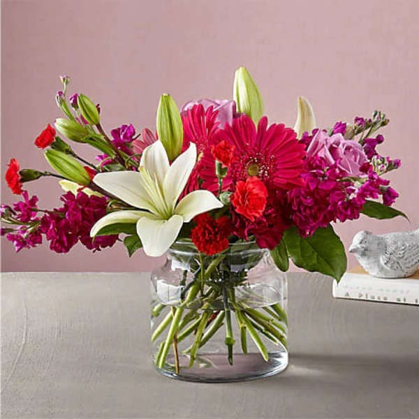 Pink and white mixed bouquet in a clear glass vase