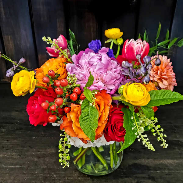 Colorful mixed bouquet in a clear glass vase