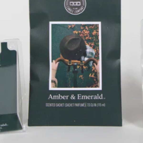 Amber and emerald scented sachet package with a bicycle rider graphic