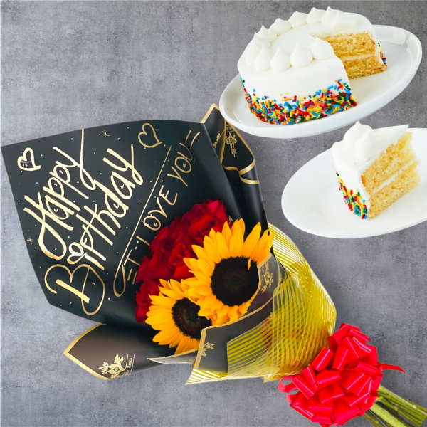 Bouquet of red roses and sunflowers with birthday cake slices