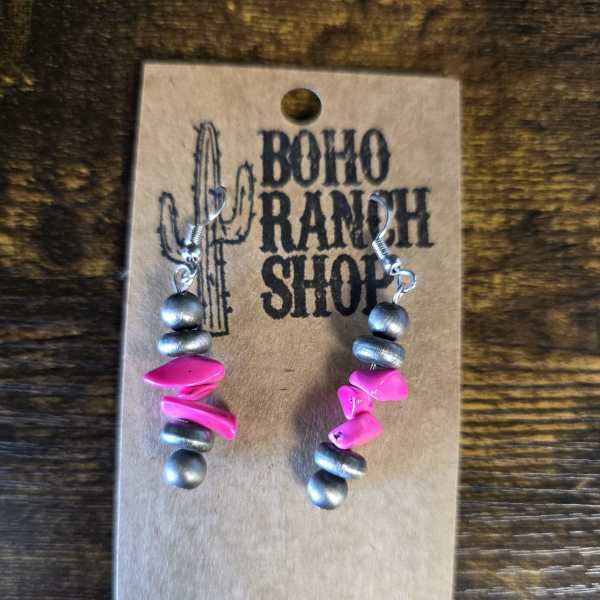 Pair of beaded earrings on a cardboard display card