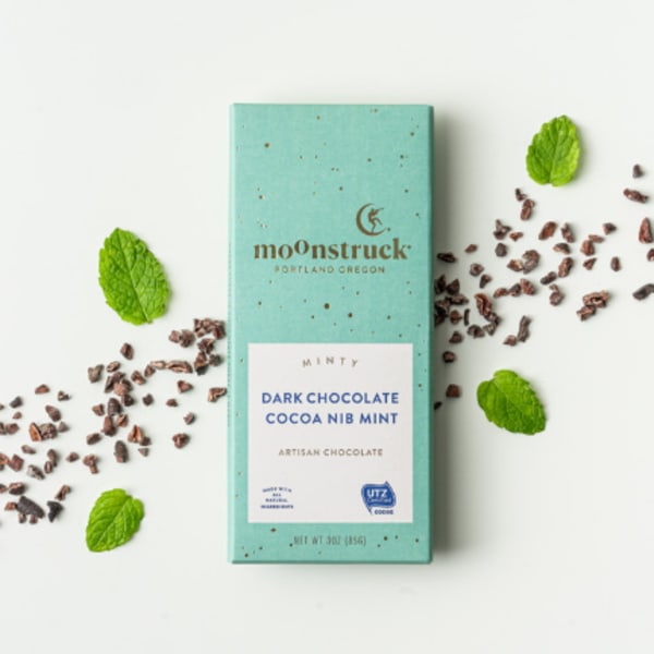 Mint chocolate bar with cocoa nibs and mint leaves