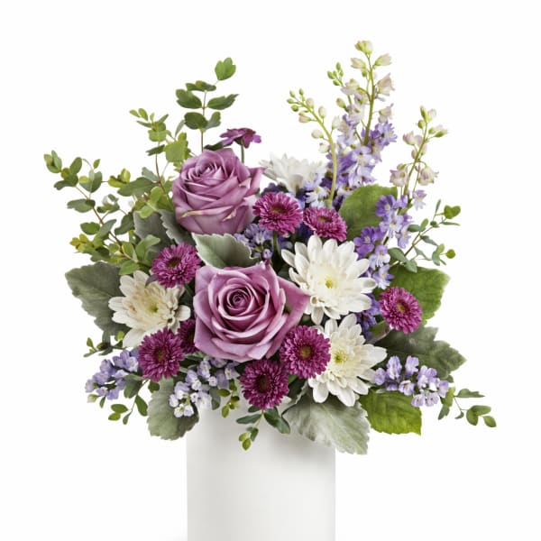 Lavender roses and white daisies in a white vase