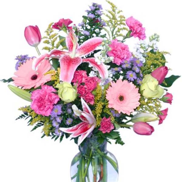 Pink and purple mixed bouquet in a clear glass vase