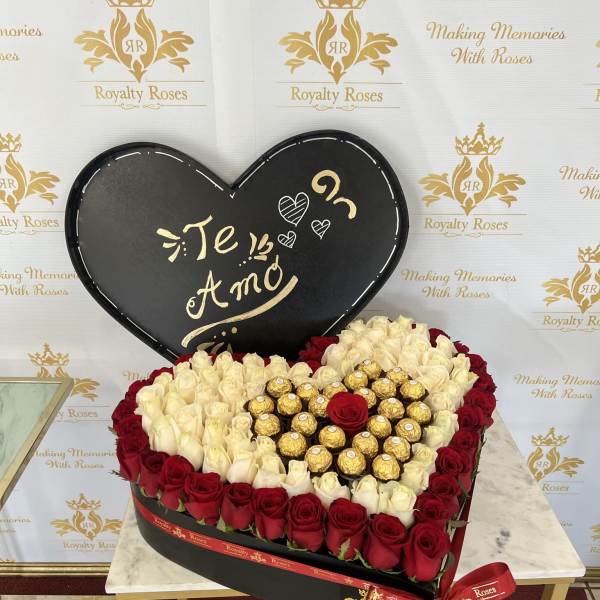 Heart-shaped rose box with red and white roses and gold chocolates