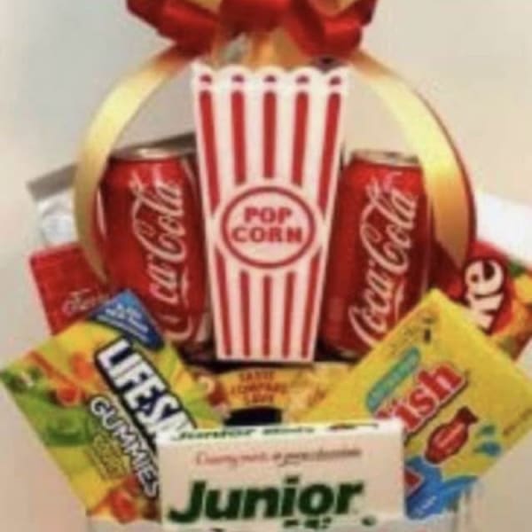 Popcorn bucket gift basket with soda cans and candy