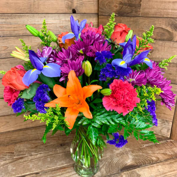 Colorful mixed bouquet in a clear glass vase