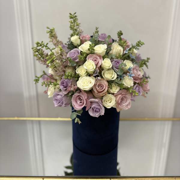 Bouquet of pastel roses in cream, pink, and lavender