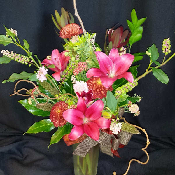 Autumn mix with lilies and kiwi branches