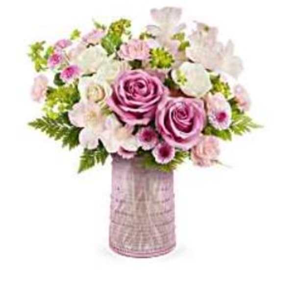 Pink and white flower bouquet in a tall vase